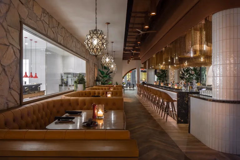 VanRooy Design bistro interior designer designing cozy restaurant space with rock and tile elements